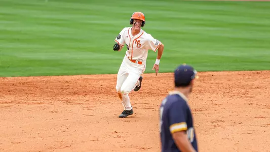 Treyson Hughes running around the base path
