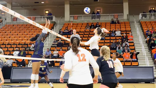 Lillian Beardsley hitting ball