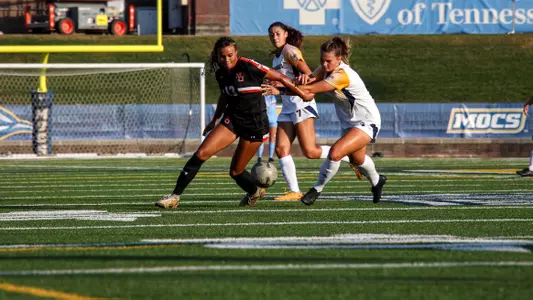 Jada Moorman dribbling past defender