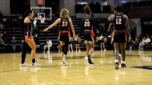 WBB team walking on court