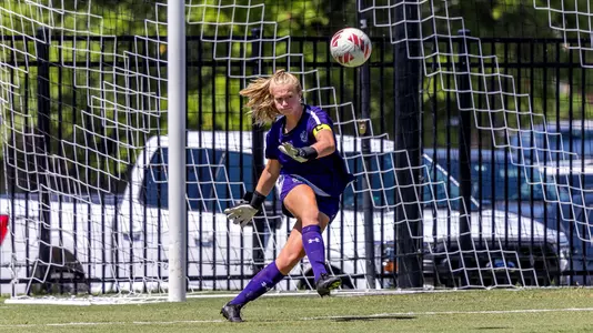 Lindsay Bell kicking ball