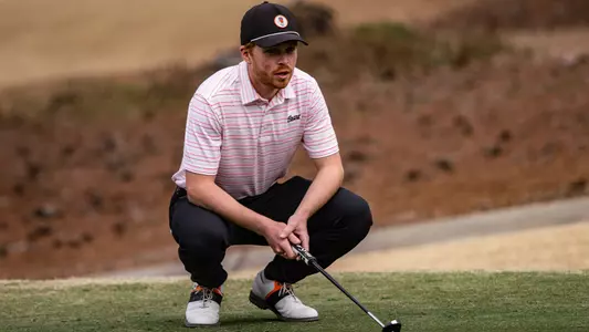 Tobias lining up a putt