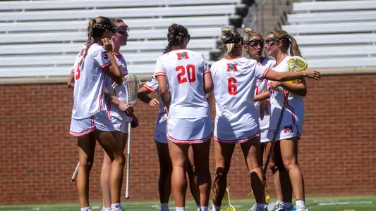 women's lax team huddle
