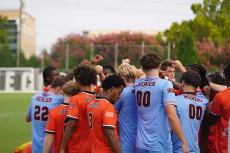 Men's soccer team huddle