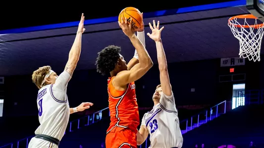 Alex shooting over defender