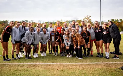 Wsoccer team picture with runner-up trophy