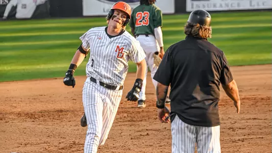 Ty Dalley rounding the bases vs. FAMU