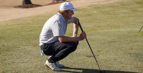 Henry Robards reading the green