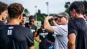 Coach Ruzzo in Huddle at Practice