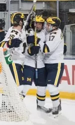 Nick Pastujov celebrates a goal 2:16 into his Michigan debut