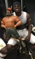 Jake Butt (L) and Jabrill Peppers with the Paul Bunyan Trophy after Saturday's win at Michigan State