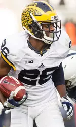Jourdan Lewis defends a pass in a game against Minnesota last season as Jabrill Peppers awaits in the secondary.