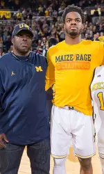 Derrick Walton Jr. with parents Derrick Sr. and Angela on Senior Day