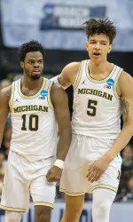 Derrick Walton Jr. and D.J. Wilson hit clutch free throws down the stretch