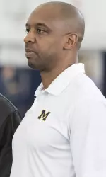 Pep Hamilton talks with Cincinnati Bengals head coach Marvin Lewis at Michigan's Pro Day on March 24, 2017