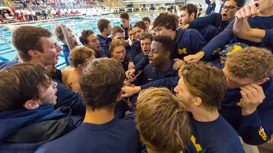 Swimming and Diving team huddle