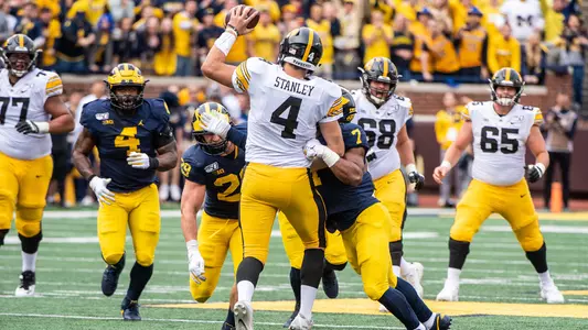 Jordan Glasgow (left), Khaleke Hudson Converge on Nate Stanley