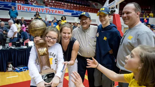 Kim Barnes Arico and family celebrate 2017 WNIT championship