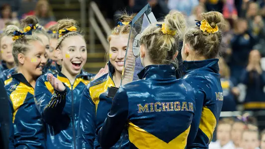 Women's Gymnastics with Big Ten Trophy