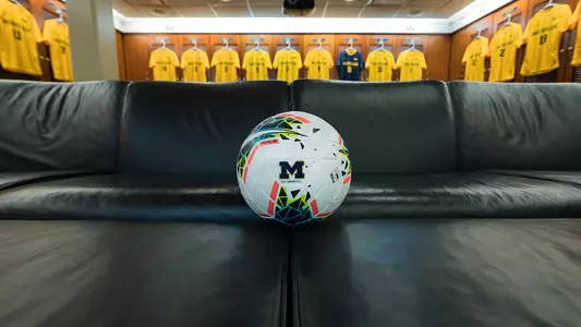 Men's Soccer Locker Room Ball on Couch Generic