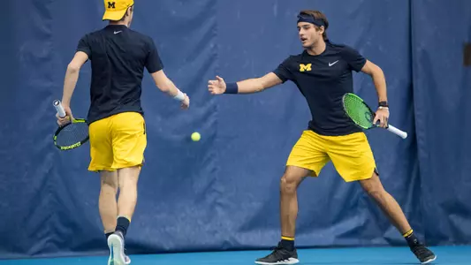 Men's Tennis doubles high-five