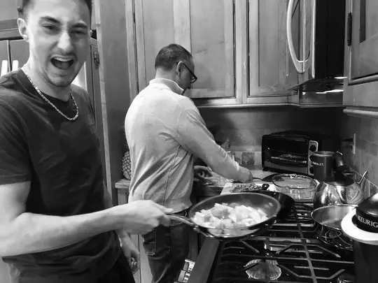 Quinn Melidona Photo - Brother Sam and Father Mario cook dinner