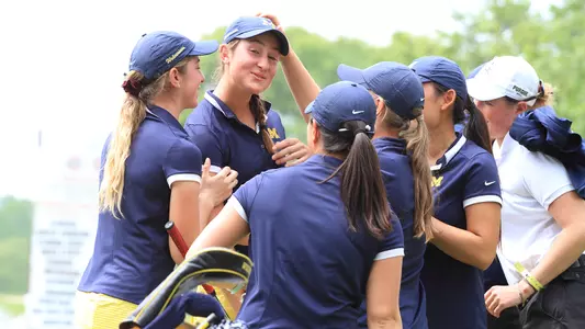Elodie Van Dievoet congratulated after birdie putt to send U-M to nationals