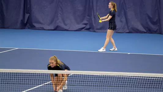 Kari Miller (serving), Alyvia Jones (Michigan Athletics photo)
