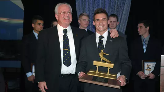 2014 Nissen-Emery Award winner Sam Mikulak (right) with coach Kurt Golder