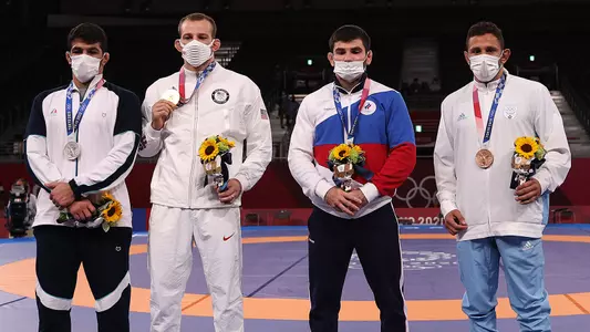 Myles Amine (right) with other 86kg freestyle medalists (Getty Images)
