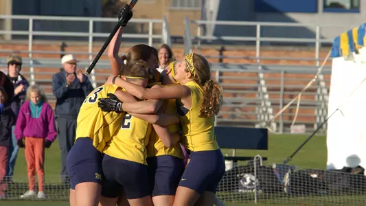 Catherine Foreman (stick raised) GWG Celebration