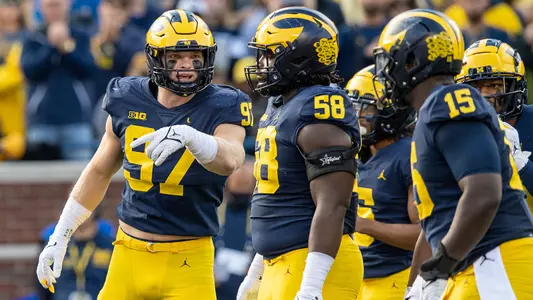 From left: Aidan Hutchinson, Mazi Smith, Christopher Hinton