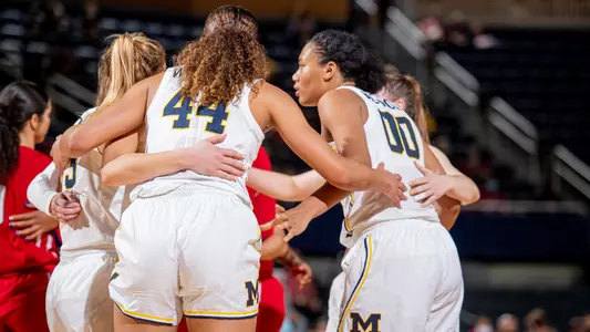 Women's Basketball Group Huddle