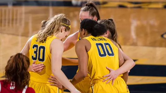 Women's Basketball Group Huddle