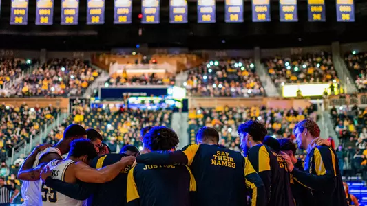 Men's Basketball Team Huddle