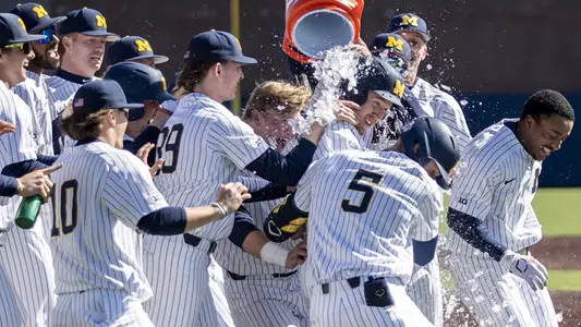 Alex Fedje-Johnson celebrates his game-winning run
