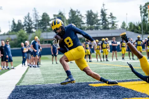 Ronnie Bell completes a catch for a touchdown in practice