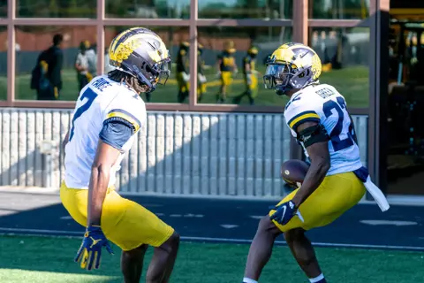 Gemon Green intercepts a pass during practice