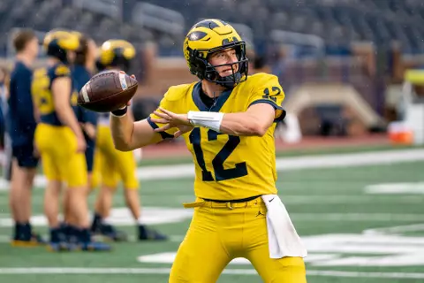 Cade McNamara prepares to throw the ball during a drill