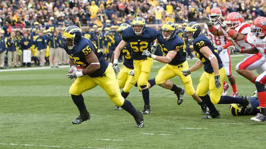 Brandon Graham (55) scores after a blocked punt