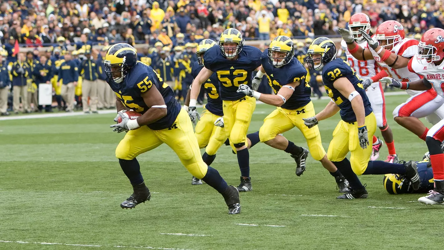 Brandon Graham (55) scores after a blocked punt