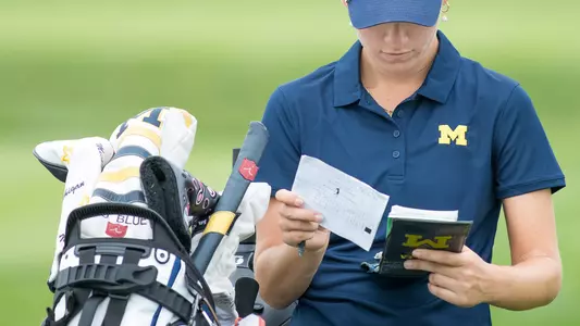 Women's Golf Checking Scorecard