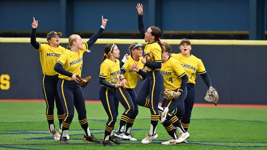 Softball outfield group celebration