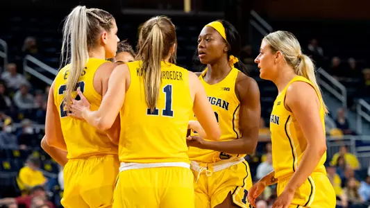Women's Basketball Group Huddle