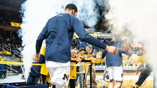 Men's basketball crowd high-five generic