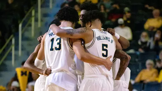 Men's Basketball Team Huddle