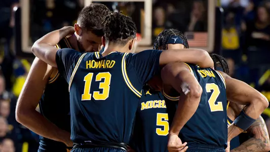 Men's Basketball Group Huddle