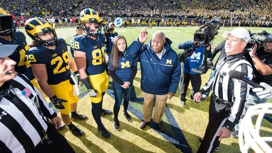 Honorary captain Henry Aaron flips the coin pregame vs. Illinois