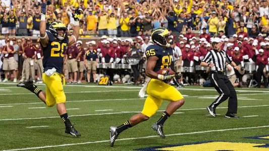 Joe Reynolds (85) and Drake Johnson