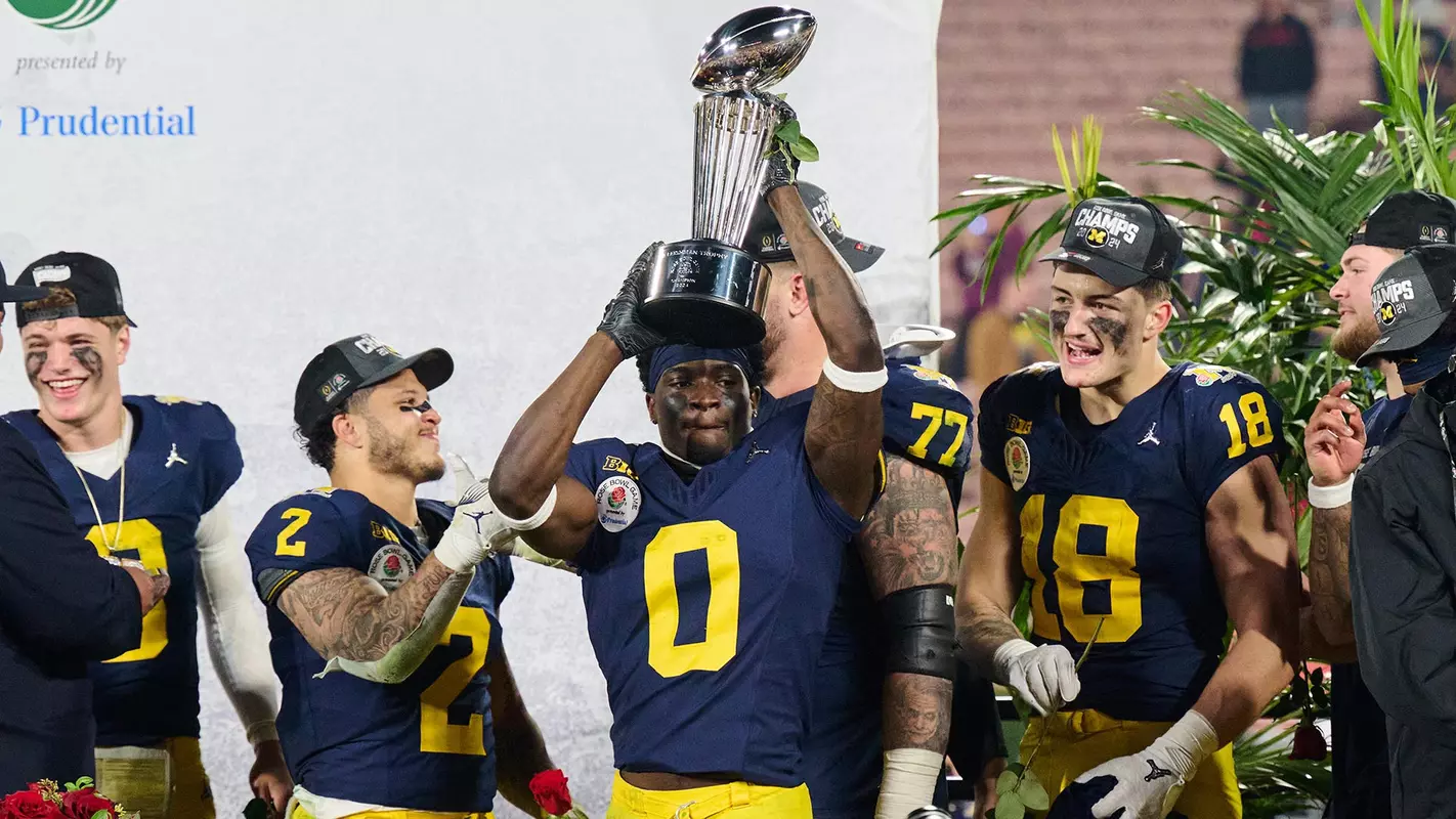 Mike Sainristil Lifts Rose Bowl Trophy